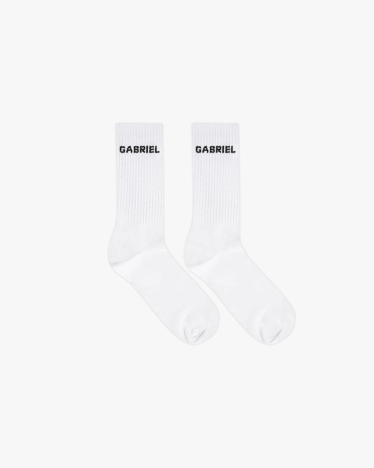 White pair of socks with black brand name print