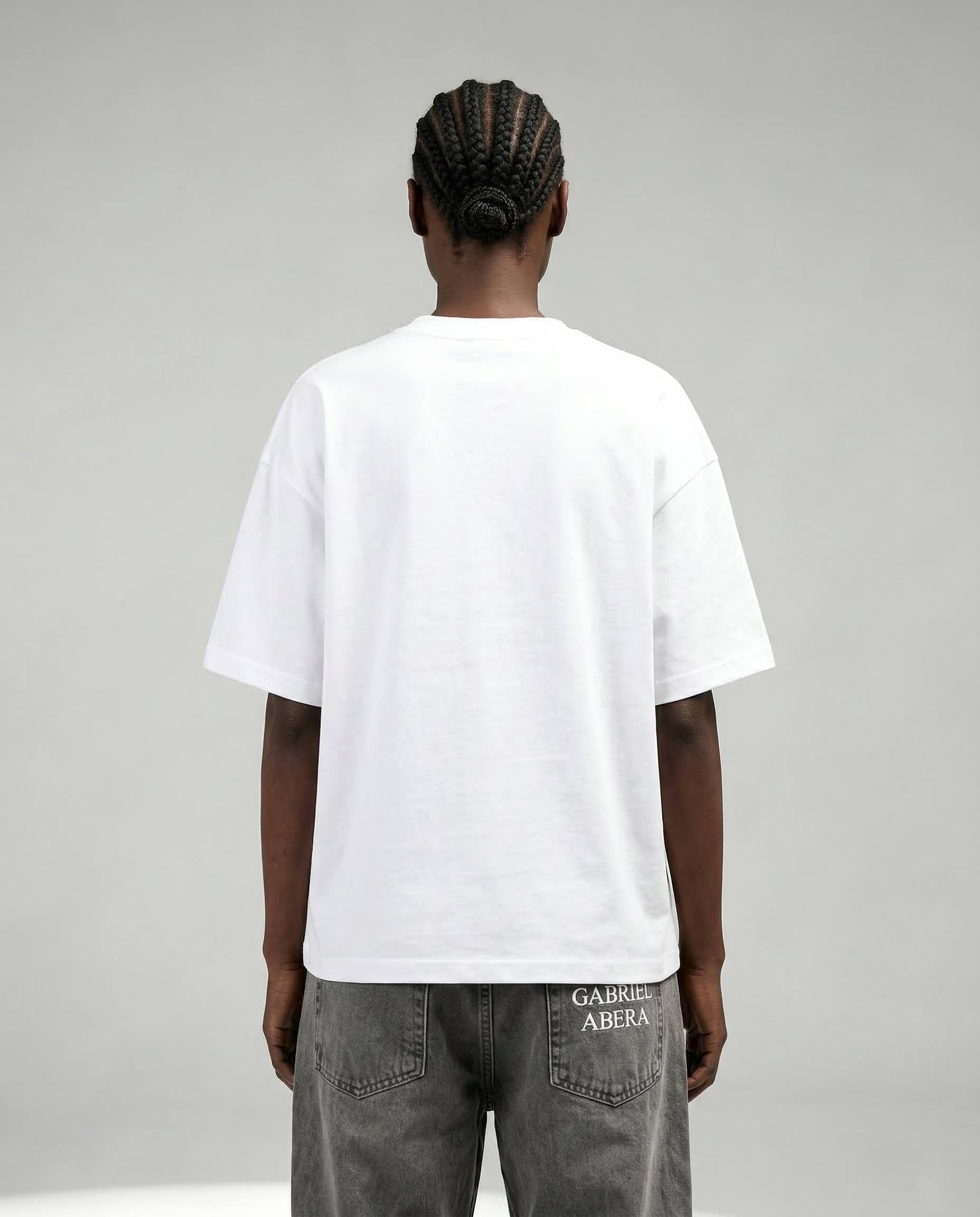Back view of white oversized boxy streetwear T-shirt by GABRIEL ABERA with clean minimal design and relaxed fit.