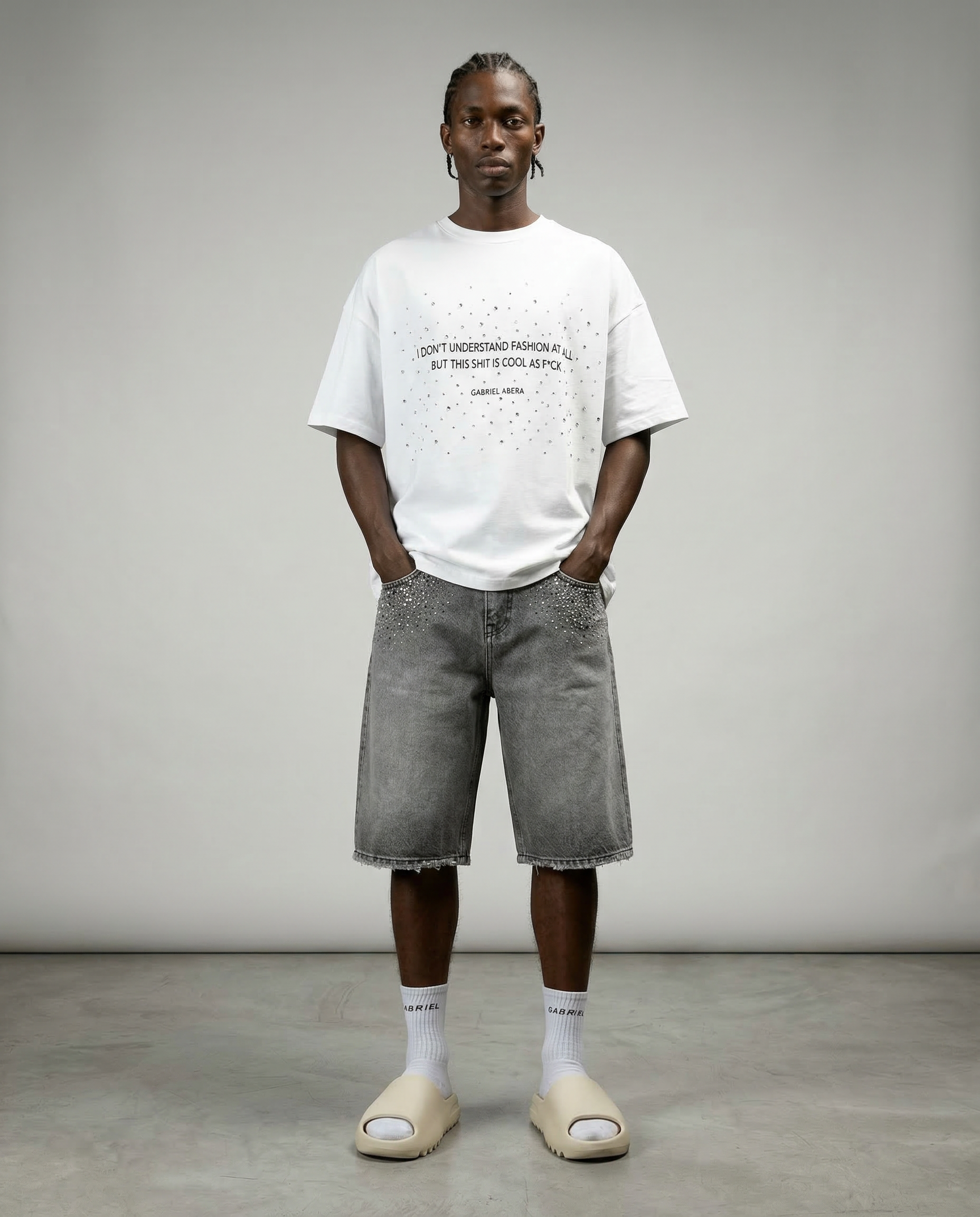 Front view of model wearing Gabriel Abera Rhinestones Denim Jorts, cropped at waist.