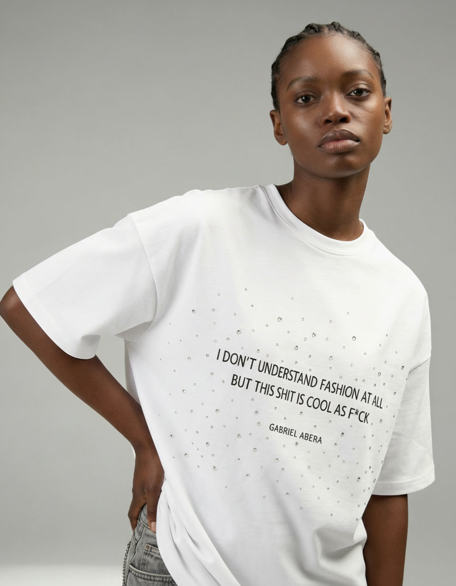 White boxy rhinestone T-shirt unisex by GABRIEL ABERA featuring statement text print and scattered rhinestone embellishments on the chest.