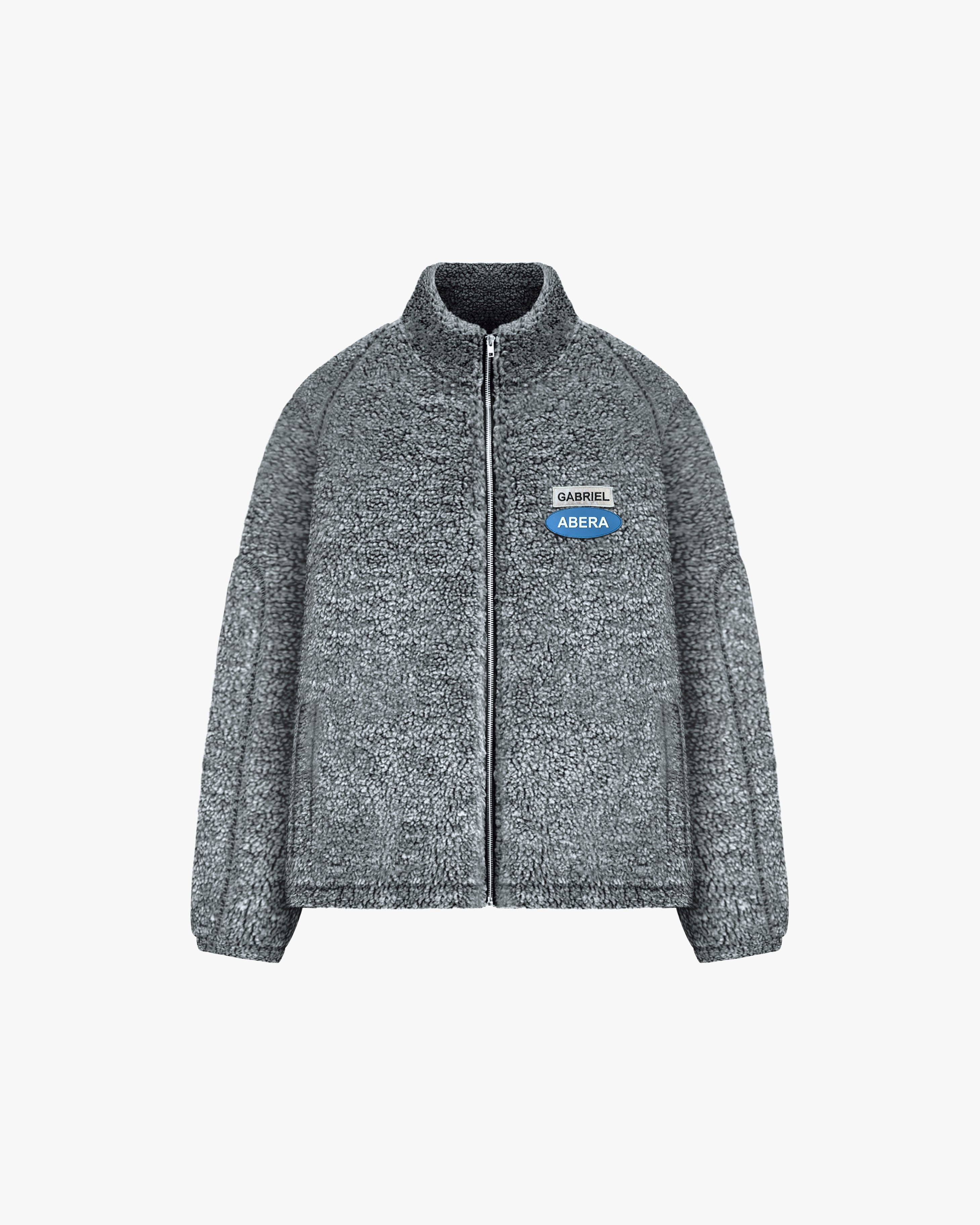 black fleece jacket with green yelgrey blue brand patches