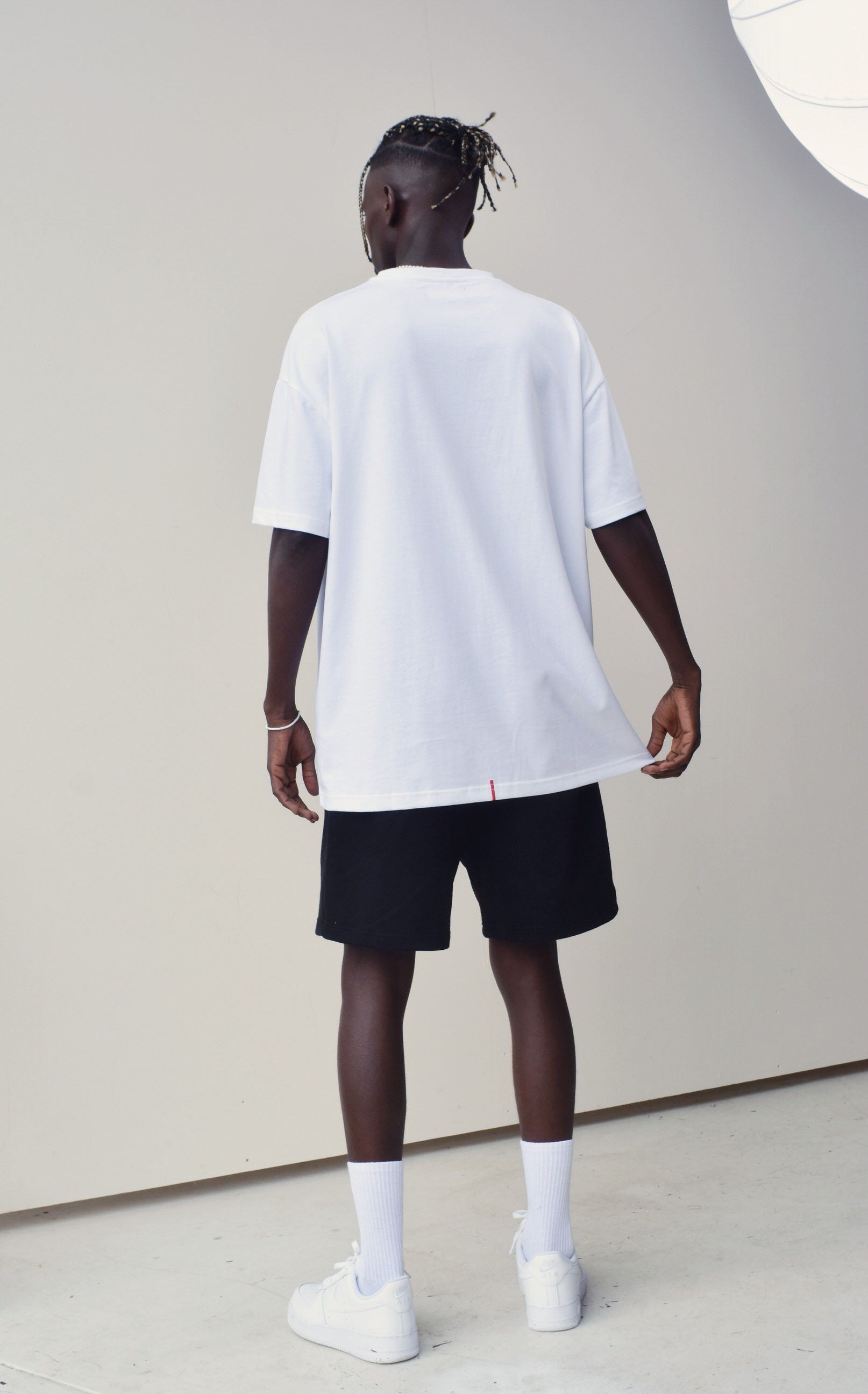 Model wearing a White oversize tshirt