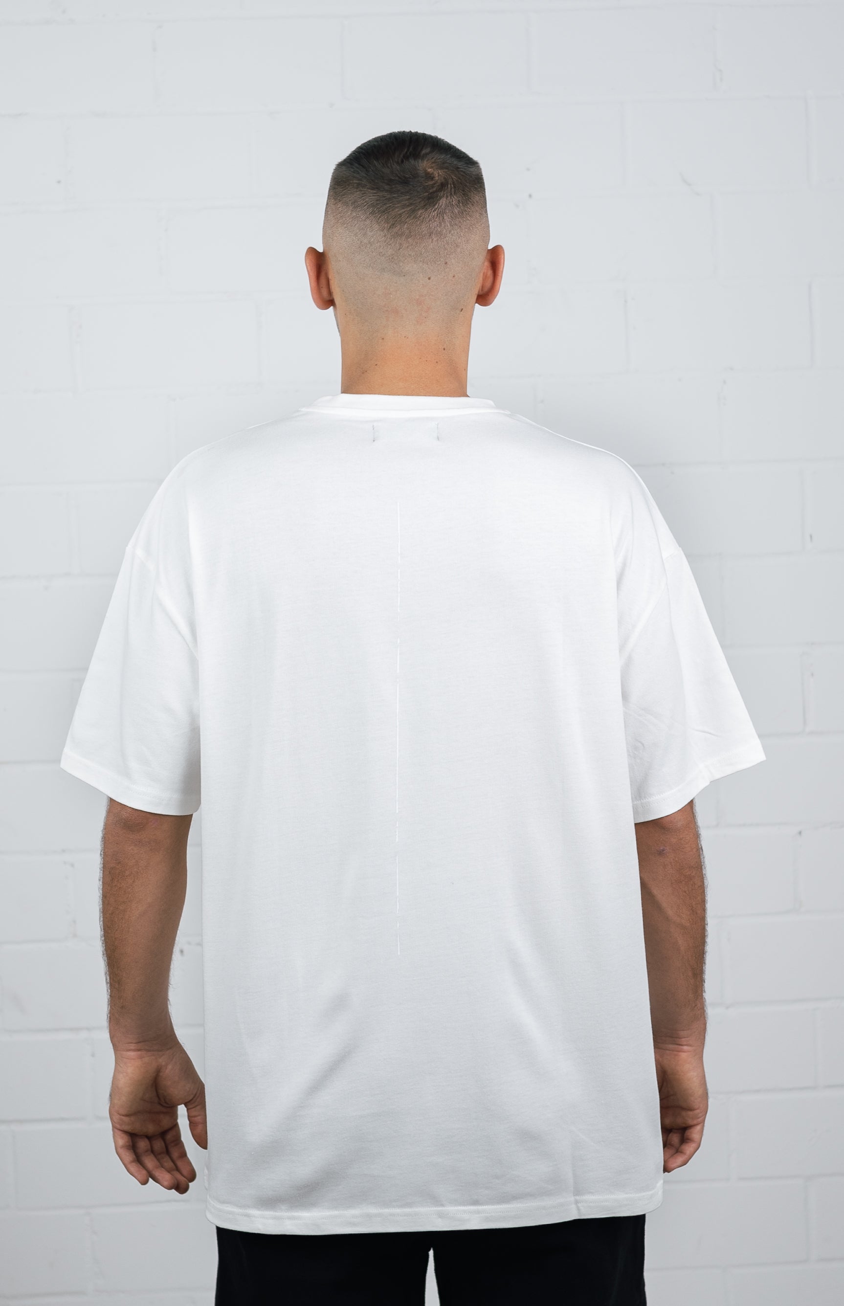 male model wearing a White oversize tshirt