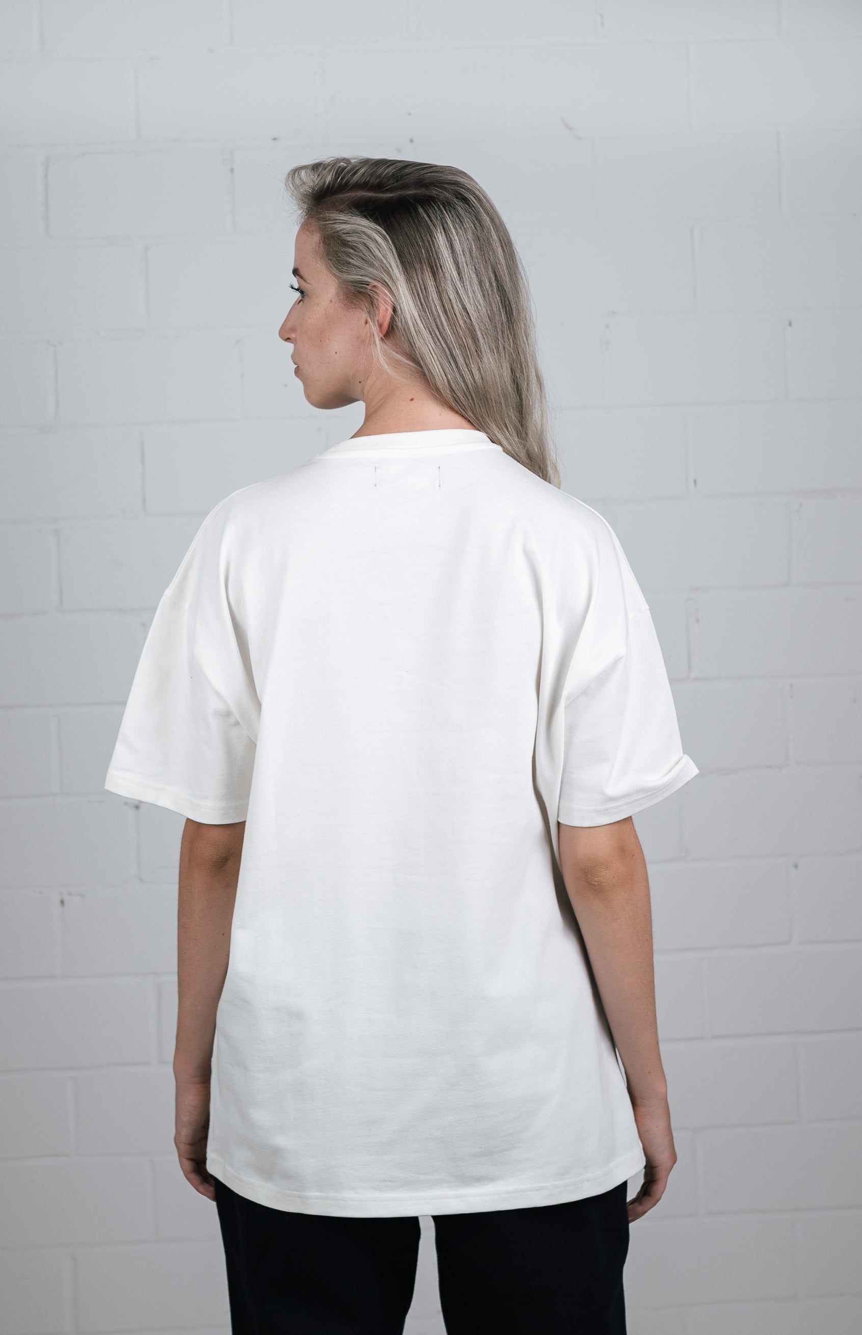 Female model wearing a White oversize t shirt