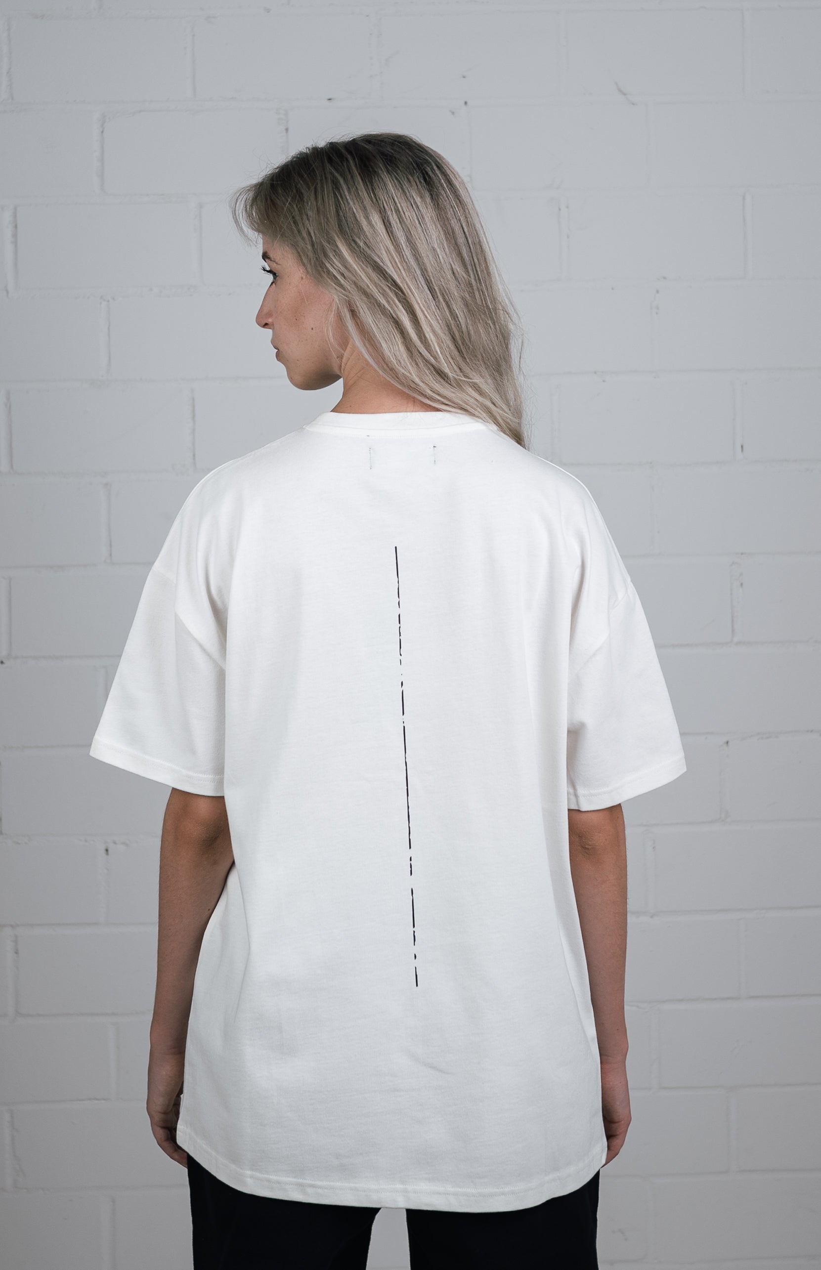 Female model wearing a White oversize tshirt