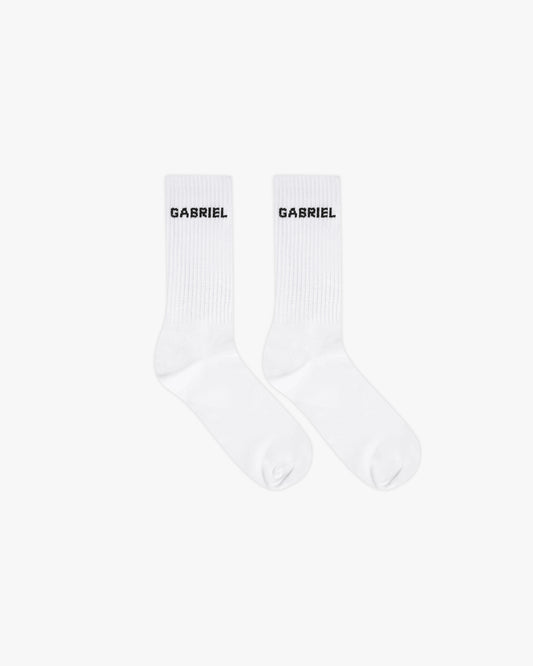 White pair of socks with black brand name print