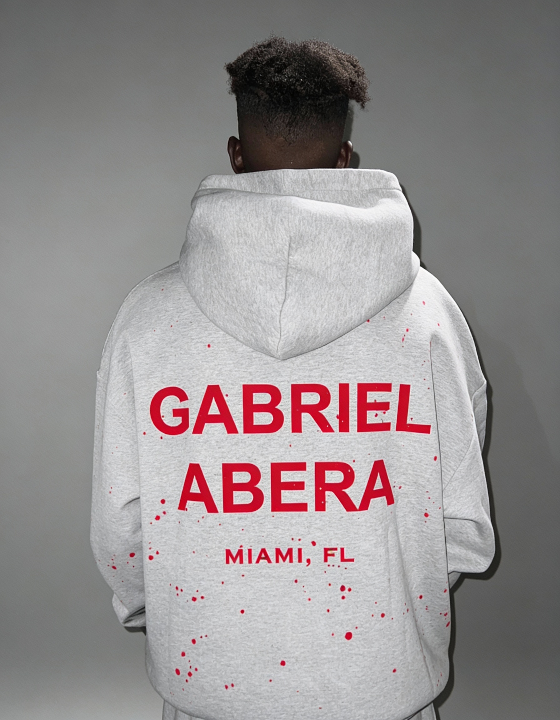 Back view of Oversized Splattered Hoodie in Grey with puff print and bold artistic streetwear vibe.