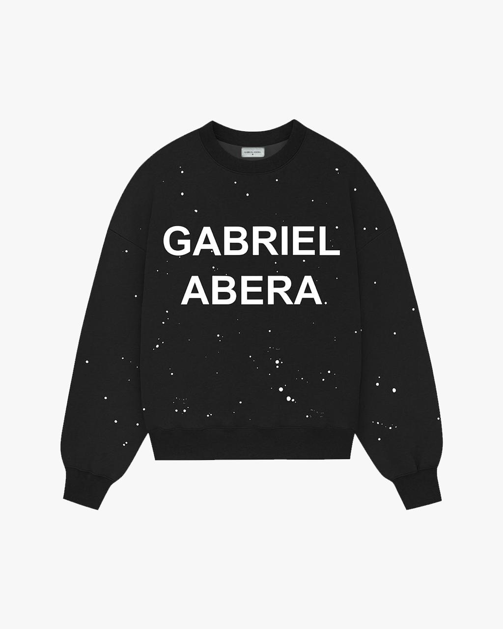GABRIEL ABERA Splattered Puff Sweater Black/White – Frontansicht mit handgemachtem Farbspritzer-Design und Puff-Print.