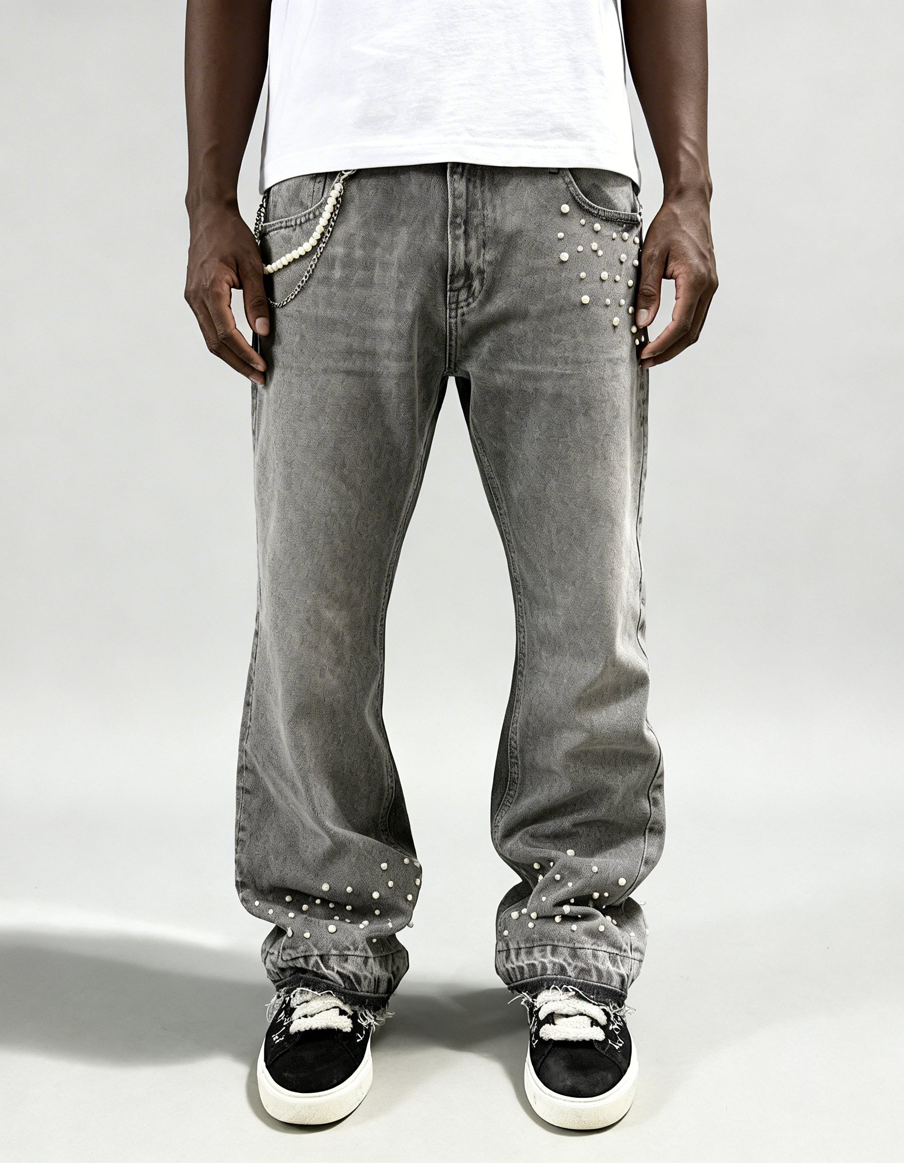 Grey pearl denim jeans by GABRIEL ABERA with loose fit, stonewashed grey fabric and hand-placed rhinestones on front pocket and hem.