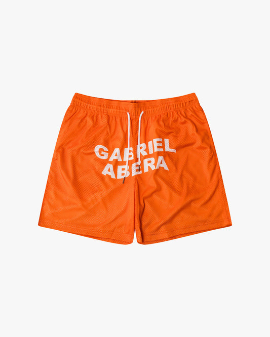 Orange mesh shorts with white brand name print in the front