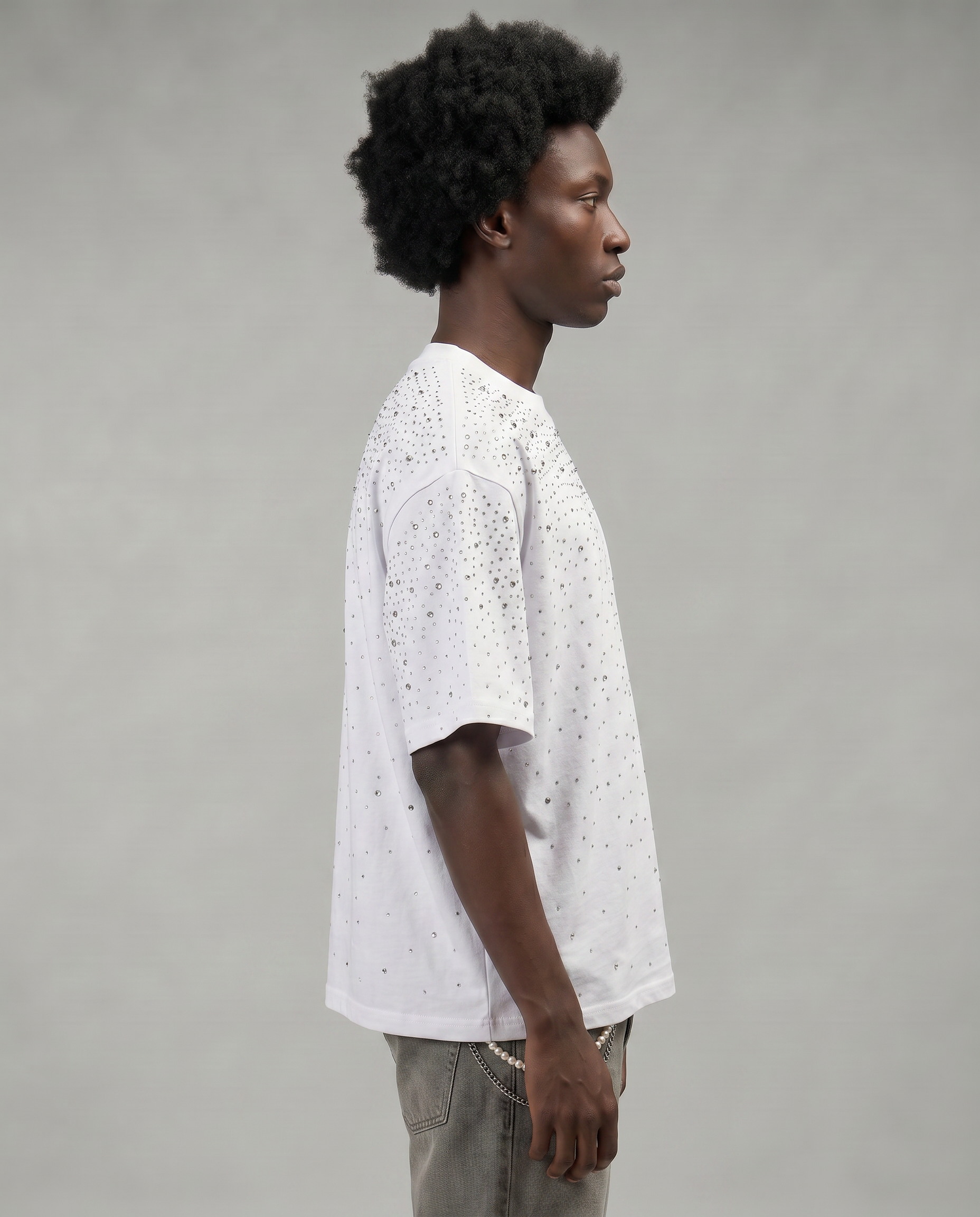 GABRIEL ABERA Rhinestone Universe Tee Off White – male model side view, hand-embellished rhinestones on chest