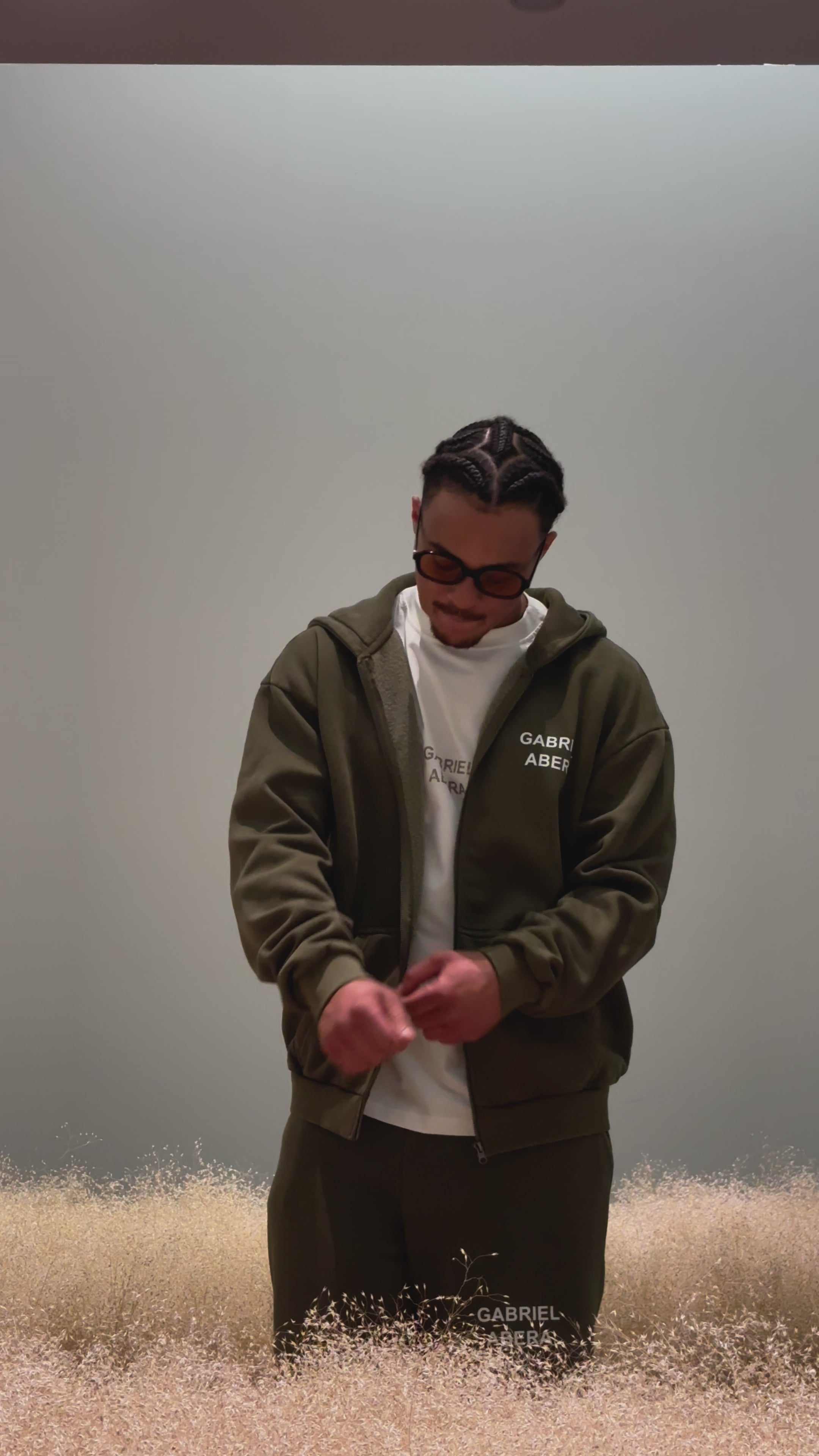 Model wearing zip hoodie khaki – relaxed fit Gabriel Abera Zipper and Shorts
