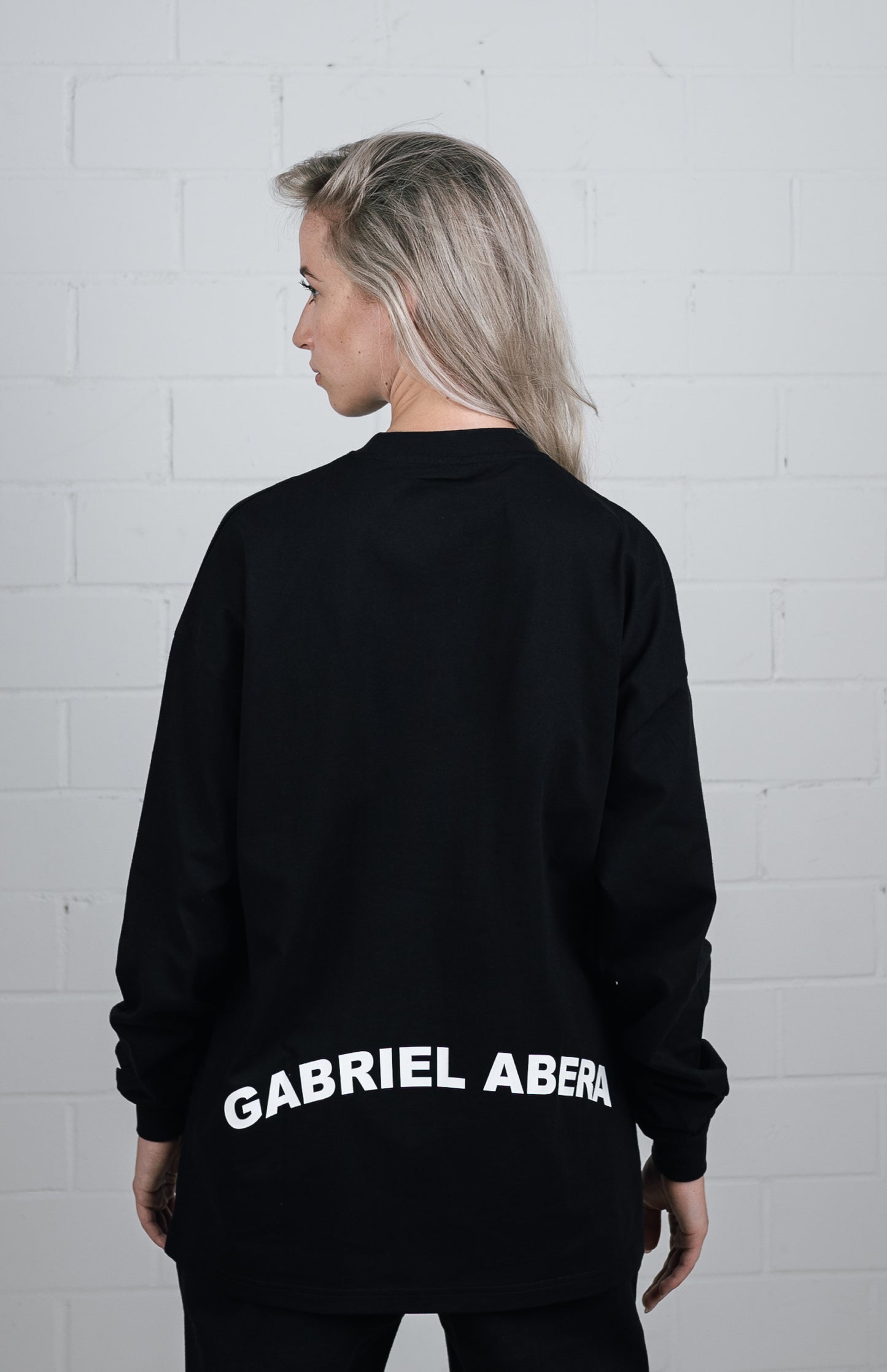 Back View Black Long sleeve worn by female model