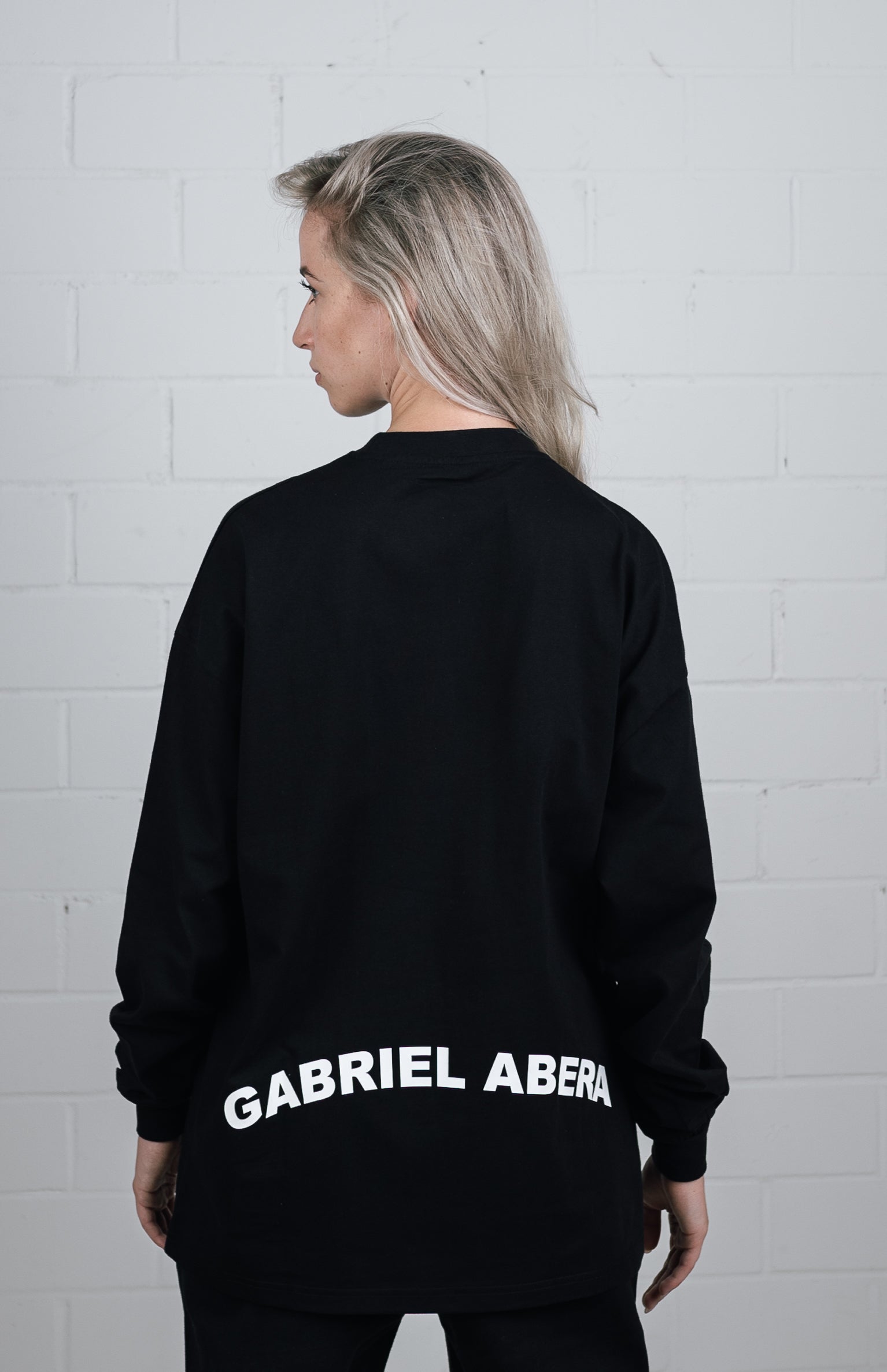 Back View Black Long sleeve worn by female model