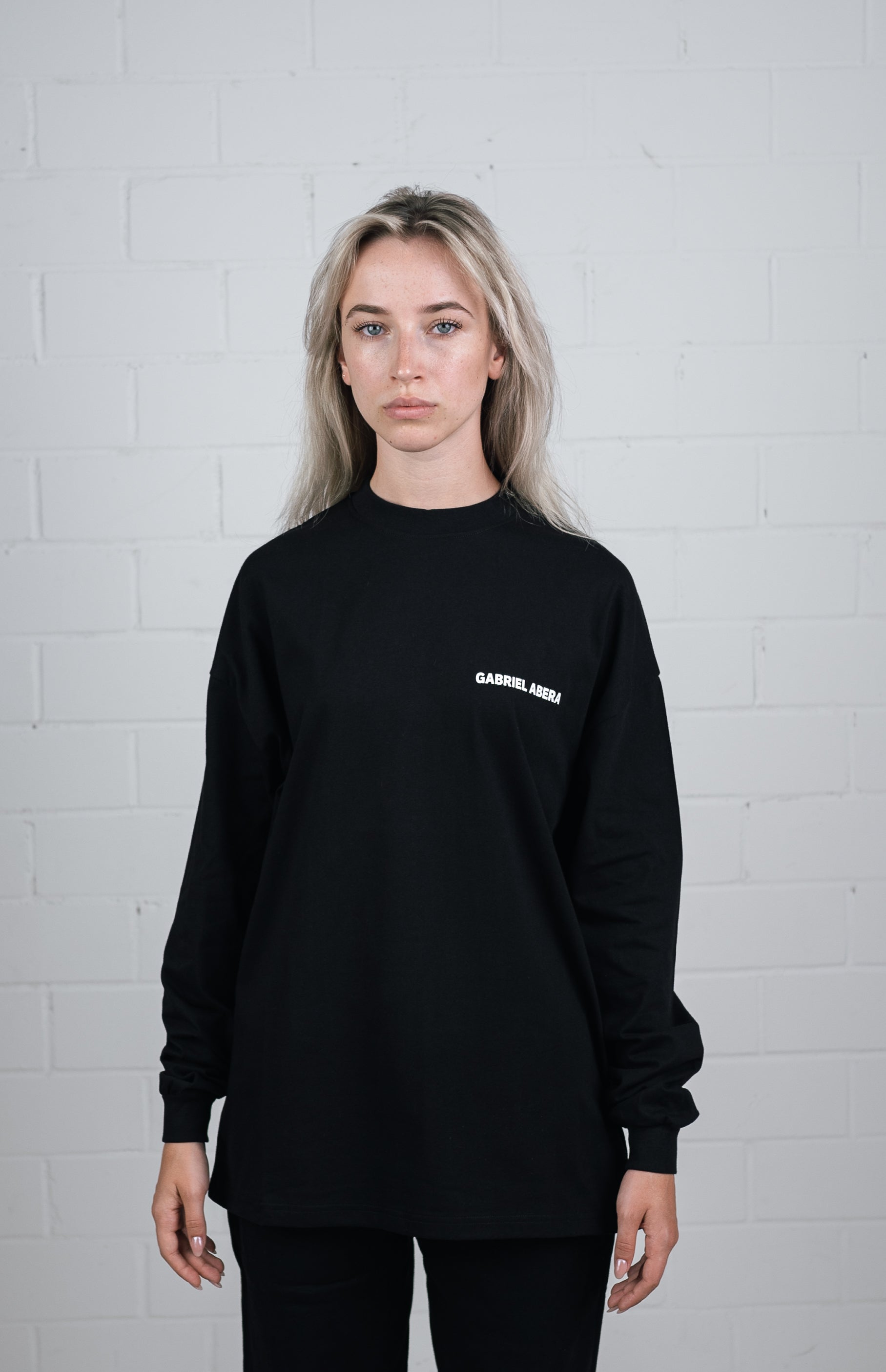 Front View Black Long sleeve worn by female model