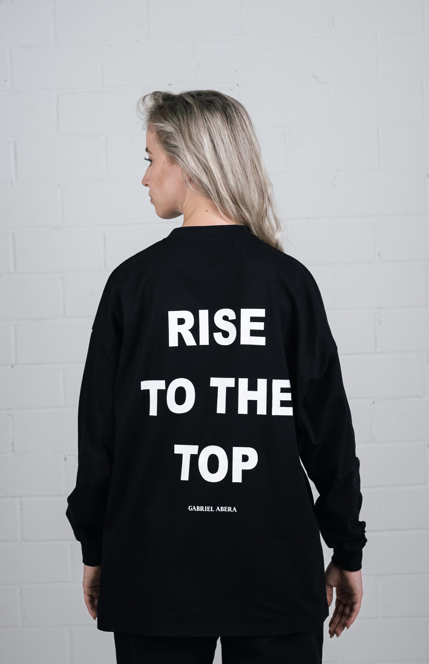 Back View Black Long sleeve worn by female model