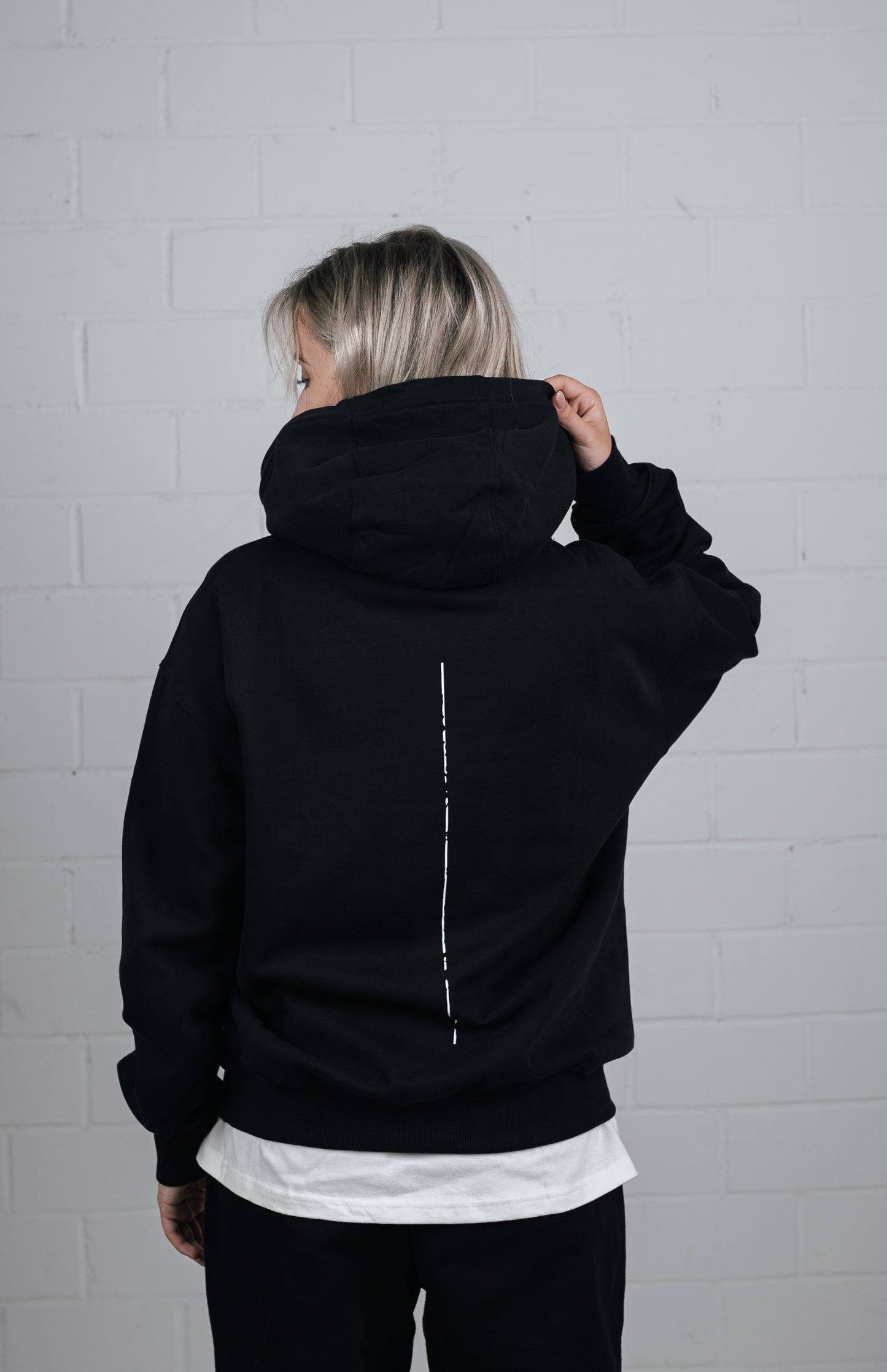 Back View Black Hoodie worn by female model