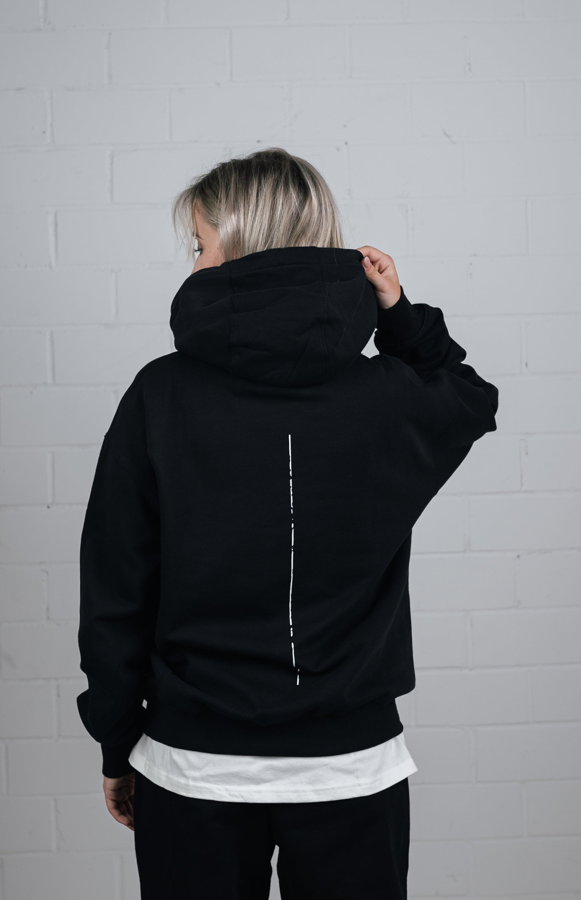 Back View Black Hoodie worn by female model