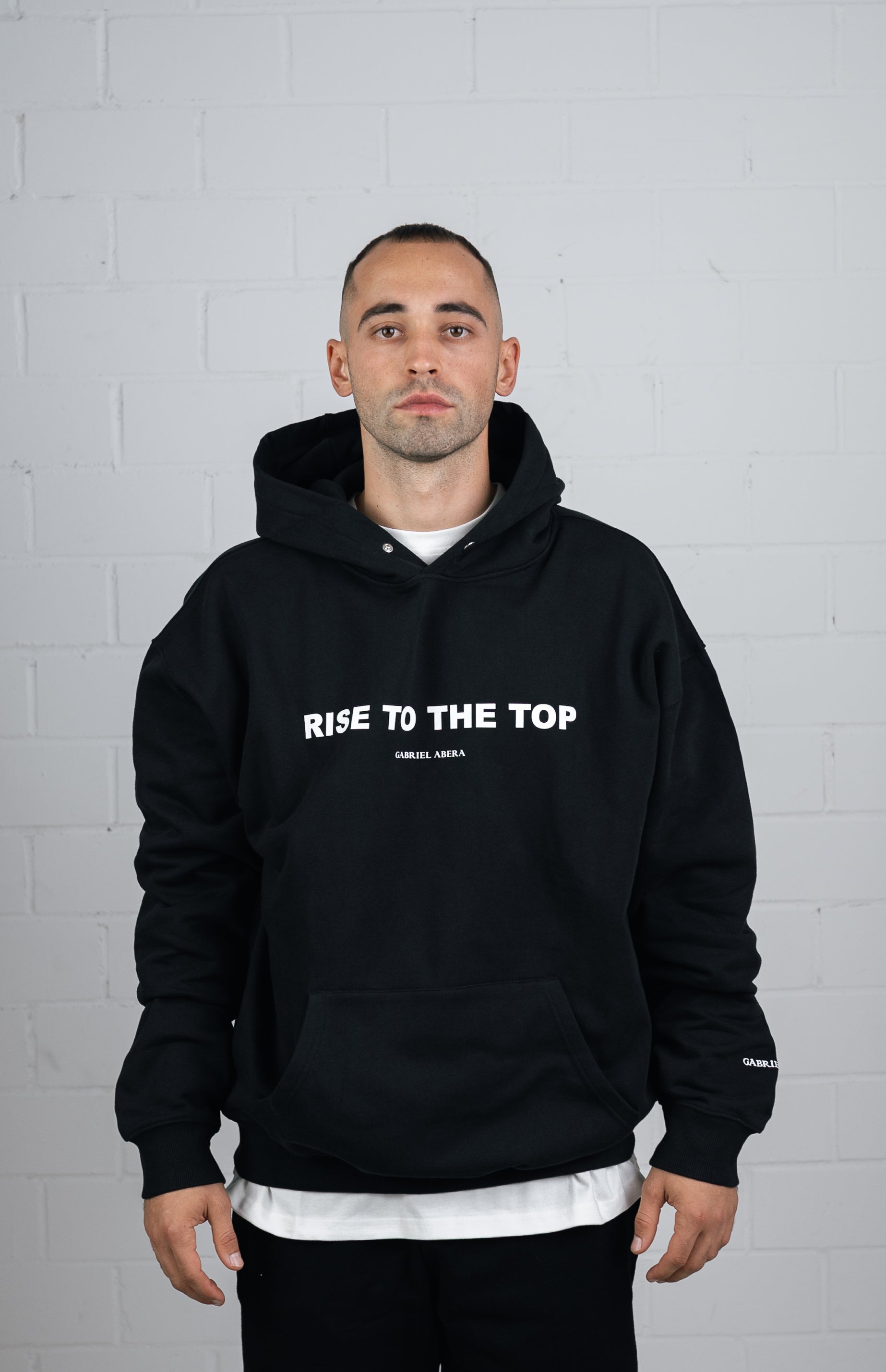 Front View Black Hoodie worn by male model