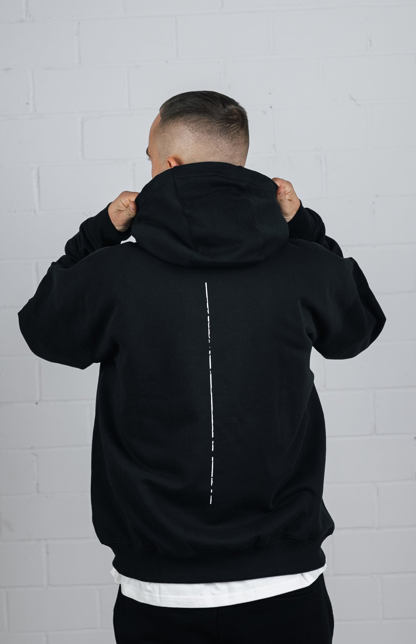 Back View Black Hoodie worn by male model