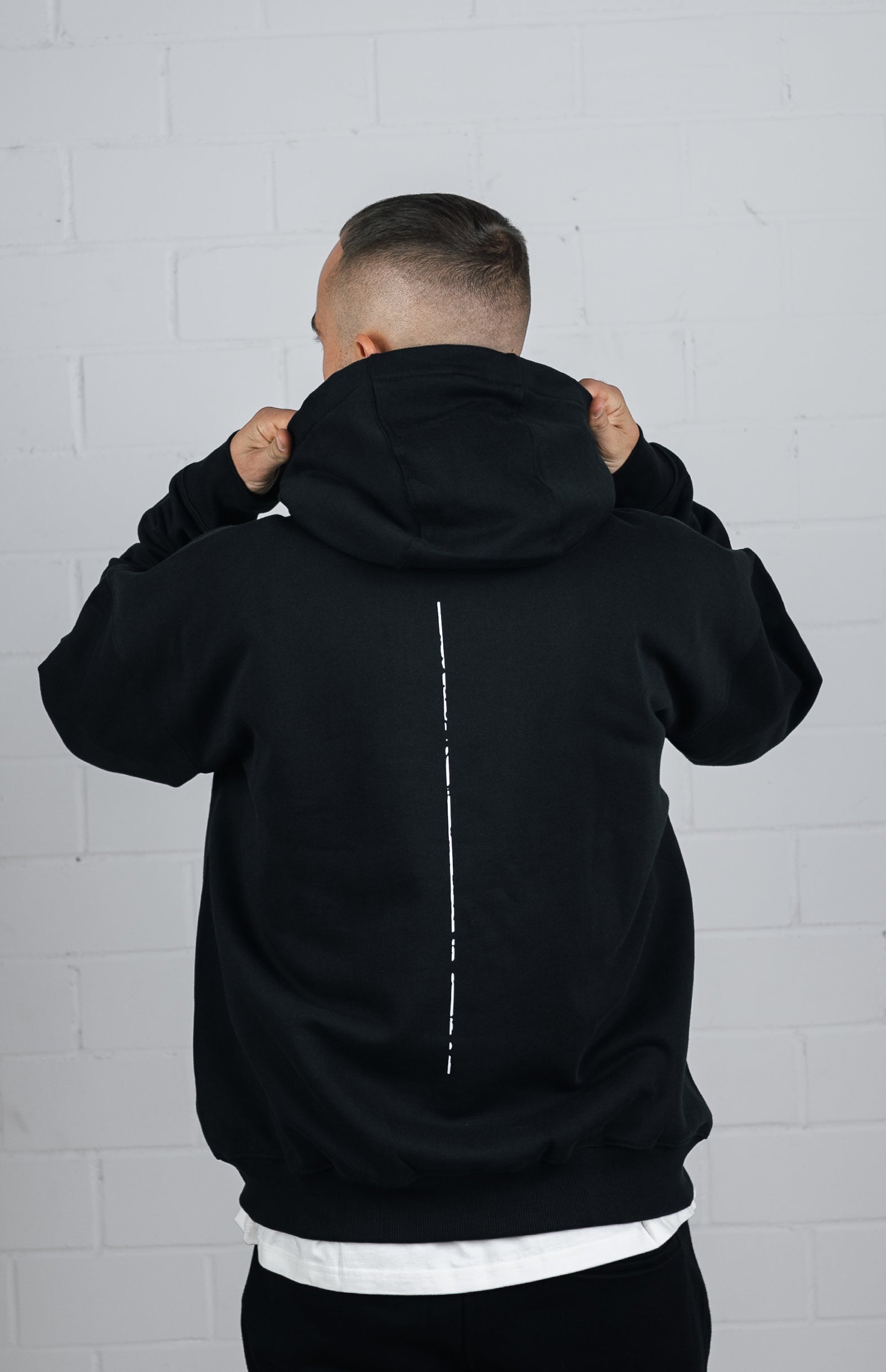 Back View Black Hoodie worn by male model