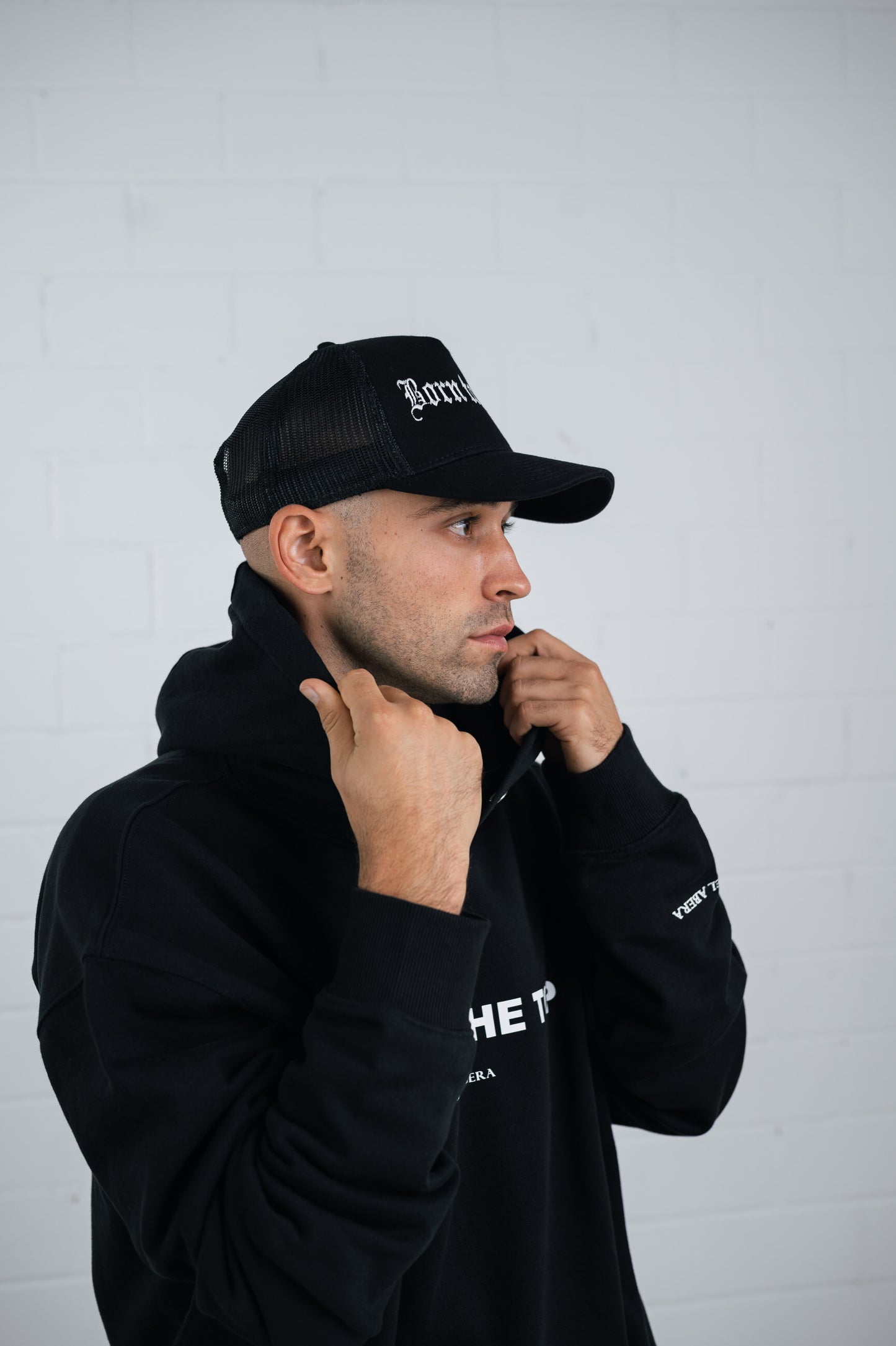 BORN 2 WIN TRUCKER CAP - BLACK